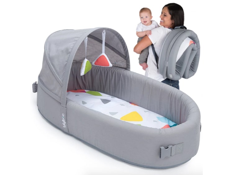 portable baby crib attached to bed
